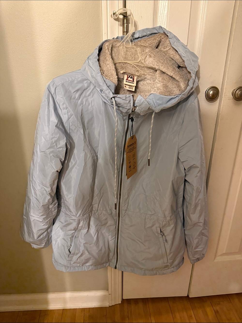 Avalanche Women's Light Blue water resistant Jacket with Sherpa Lining.